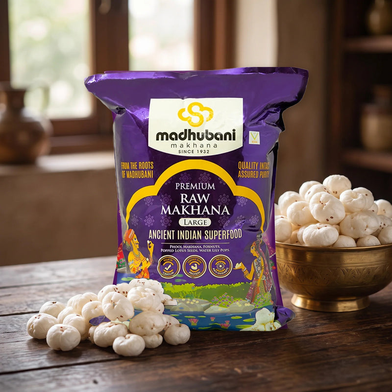 Premium raw makhana with the new Purple 5+ sutta pack on a wooden table