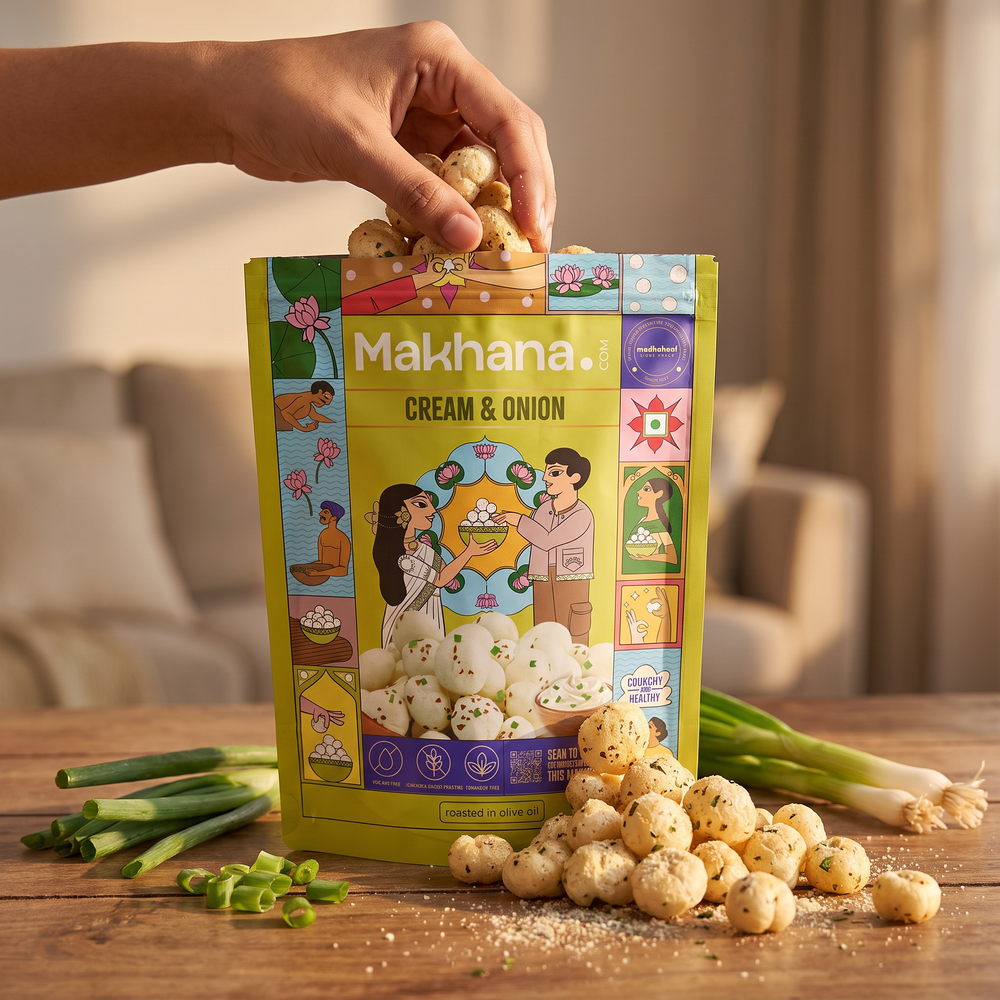 Hand taking Cream & Onion makhana from the pouch