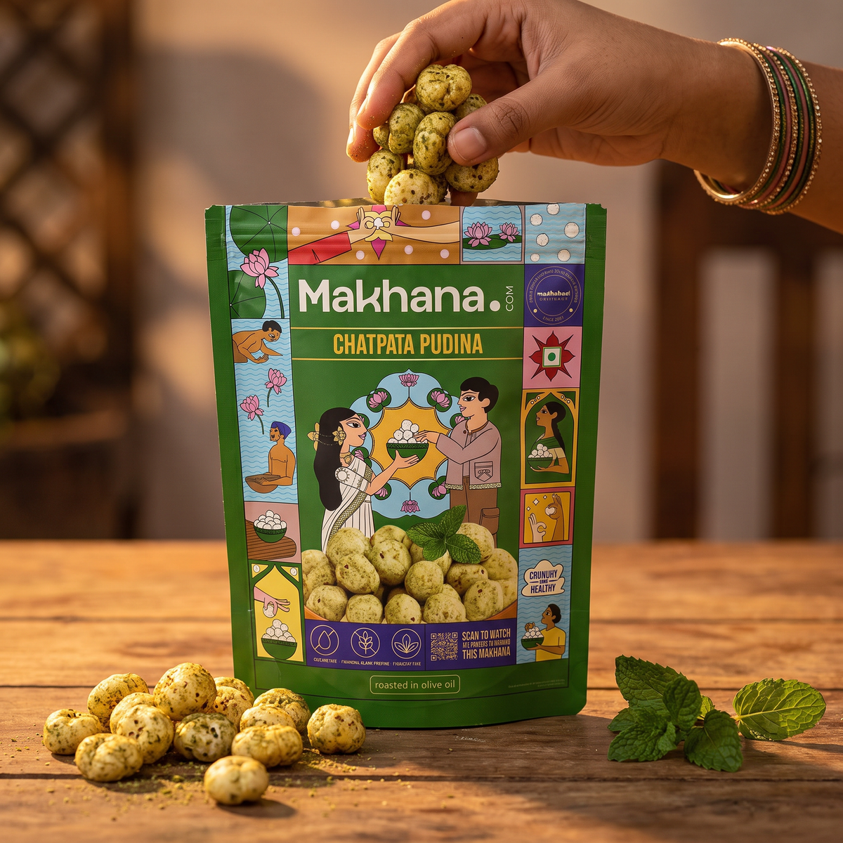 Hand taking Chatpata Pudina makhana from the pouch